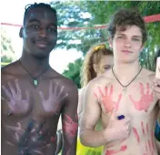  ??  ?? Monty Rahama and Stuart Beckley were creative with paint to support Jervis house at the swimming sports.