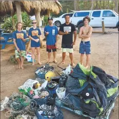  ?? Courtesy photo ?? From left: Noah Asay, Nandi Carrano, Keli Everett, Xavier de Jetley and Bohdi Asay pose behind the pile of trash from their cleanup day at Koki Beach in 2017.