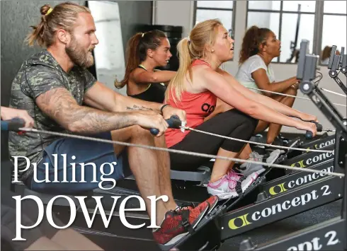  ??  ?? Oarsome: Katie Strick, centre, joins the fleet of indoor group rowing classes at Metabolic London