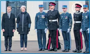  ??  ?? Cadet Atkinson, circled and right, with Mrs May and Mr Macron at the summit