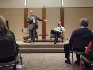  ?? (Photos: John J. Kim/Chicago Tribune/TNS) ?? RABBI STEVEN S. Lowenstein (L) introduces actor-author Brett Gelman for a live audience conversati­on at Am Shalom in Glencoe, Illinois, earlier this month.
