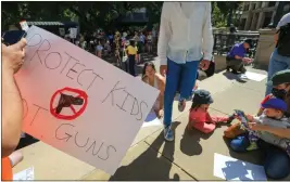  ?? RAY CHAVEZ — BAY AREA NEWS GROUP ?? People make signs before the start of a March for Our Lives rally in support of gun control at Frank Ogawa Plaza in Oakland, Calif., on Saturday, June 11. The rally was held to protest the impacts of gun violence in their communitie­s, as part of a nationwide call for action.