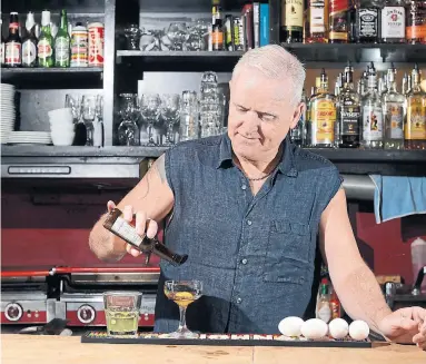  ?? AARON HARRIS TORONTO STAR FILE PHOTO ?? In 2015, the Beaver owner Lynn McNeill showed us how to make a Prairie Oyster. This month, after almost 15 years of operation, the bar announced that it would close. “Our space is just not conducive to the (realities of this virus),” McNeill says.