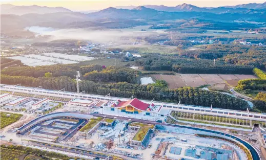  ?? HU CHAO/XINHUA ?? The Ganlanba railway station is part of the Kunming-Vientiane railway that will link China and Laos.