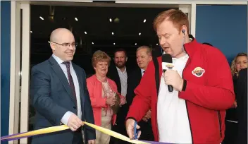  ??  ?? The official opening of Choice at Mill Retail Park in Gorey. South East Radio DJ Tony Scott cuts the tape with general manager Michael Brett.