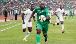  ??  ?? NDOLA: Zambia’s Collins Mbesuma runs with the ball during the FIFA World Cup qualifier between Zambia and Nigeria at the Levy Mwanawasa Satdium in Ndola yesterday. — AFP