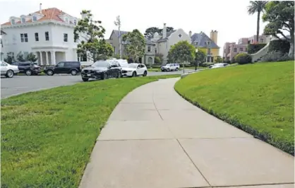  ??  ?? SAN FRANCISCO: A sidewalk leads into luxury homes in the Presidio Terrace neighborho­od on Monday. — AP