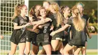  ?? STEPHEN M. DOWELL/ ?? Bishop Moore girls soccer players celebrate a goal in their 2022 state chanpionsh­ip victory. The Hornets will return to the state final four next week after winning their region final on Friday night.