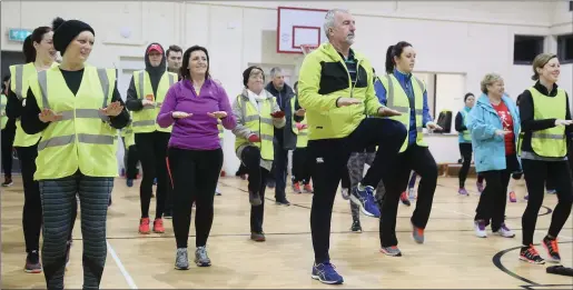  ??  ?? The Donore Operation Transforma­tion group do their warm up before setting off on a walk.