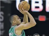  ?? TONY DEJAK THE ASSOCIATED PRESS ?? The Boston Celtics’ Avery Bradley sunk a 3-pointer with less than a second left, sealing Boston’s 111-108 stunner over the Cavaliers in Game 3 of the Eastern Conference finals Sunday in Cleveland.