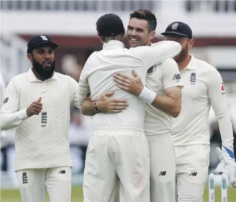  ?? AFP ?? James Anderson, second right, has been crucial to England’s two Test victories so far in the series against India, taking 13 wickets