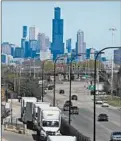  ?? ANTONIO PEREZ/CHICAGO TRIBUNE ?? Diesel trucks enter a busy rail intermodal yard May 6 in Cicero.