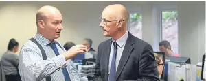  ??  ?? Castle Water CEO John Reynolds chats with Deputy First Minister John Swinney during a visit to the group’s Blairgowri­e headquarte­rs last year.
