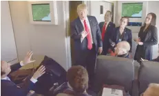  ?? — AFP ?? President Donald Trump chats with reporters on board Air Force One before departing from Andrews Air Force Base bound for Florida on Friday.