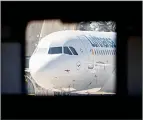  ??  ?? A parked Lufthansa aircraft is seen through a hangar
window at the airport in Frankfurt, Germany on July
30, 2020. (AP)