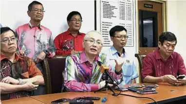  ??  ?? Changing the game: Dr Wee holding a press conference while Deputy Internatio­nal Trade and Industry Minister Datuk Chua Tee Yong (in white) looks on.
