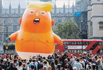  ?? LUKE MACGREGOR BLOOMBERG ?? The “Trump Baby” blimp, a helium-filled effigy of U.S. President Donald Trump, lifts off from Parliament Square in London on Friday. Trump has ducked the biggest protest against his visit by avoiding London.