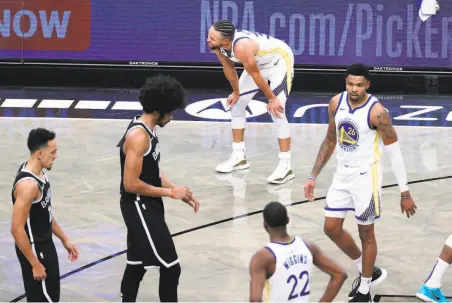  ?? Photos by Sarah Stier / Getty Images ?? Stephen Curry ( top) and the rest of the Warriors chased the Nets all night long, on the hardwood as well as on the scoreboard.