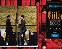  ??  ?? Bollywood actors Ritesh Deshmukh (left) and Manish Paul perform on stage as they host IIFA Rocks.