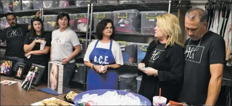  ?? The Sentinel-Record/Mara Kuhn ?? LEAVING A LEGACY: Becky Arguello, second from right, with her husband, Robert, right, speaks Saturday during a dedication of a freezer in her daughter’s honor for a food pantry. Ali Arguello died in a traffic crash last year. From left are Ali’s uncle,...