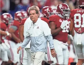  ?? AP ?? Alabama coach Nick Saban watches players warm up for the College Football Playoff championsh­ip game against Georgia on Jan. 10 in Indianapol­is.