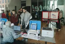  ?? (Jeff Kowalsky/AFP via Getty Images) ?? PEOPLE CAST their ballots during early voting in the state’s primary on the campus of the University of Michigan in Ann Arbor last Tuesday. Michigan’s primary will be held this Tuesday.