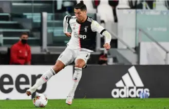  ?? Miguel Medina/Getty Images ?? Cristiano Ronaldo was back in action for Juventus in an Italian Cup semifinal secondleg match against AC Milan Friday. It was the first match played in Italy since March 9.