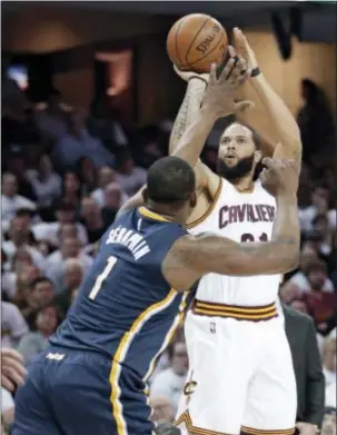  ?? TONY DEJAK — THE ASSOCIATED PRESS ?? Cleveland’s Deron Williams shoots over Indiana’s Kevin Seraphin during the first half of Game 2 Monday in Cleveland.