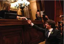  ??  ?? Catalan president Carles Puigdemont casts his vote for independen­ce from Spain at the Catalan government building in Barcelona yesterday. Photo: David Ramos/Getty Images
