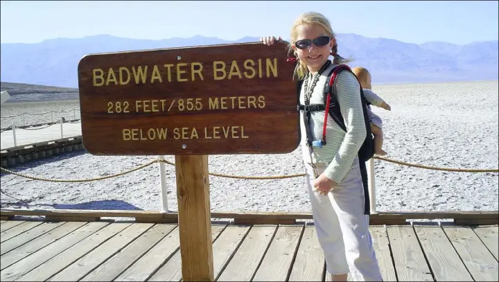  ?? Photos by Deborah Wall Las Vegas Review-Journal ?? Children should wear sunglasses when hiking in exposed areas, as this visitor is during a visit to Badwater Basin in Death Valley National Park, California.