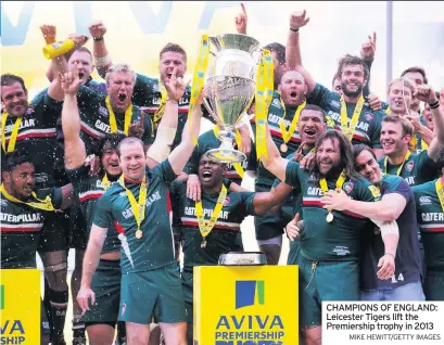  ?? MIKE HEWITT/GETTY IMAGES ?? CHAMPIONS OF ENGLAND: Leicester Tigers lift the Premiershi­p trophy in 2013