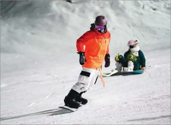  ?? PHOTOS PROVIDED TO CHINA DAILY ?? Li Song, a snowboard fan in his 30s, practices at Nanshan Ski Resort in Beijing in January.