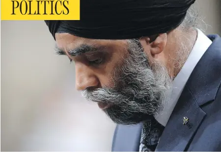  ?? ADRIAN WYLD / THE CANADIAN PRESS ?? Defence Minister Harjit Sajjan bows his head during question period in the House of Commons on Parliament Hill in Ottawa on Tuesday.