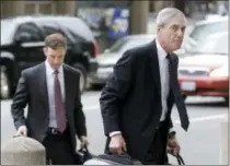  ?? JEFF CHIU — THE ASSOCIATED PRESS ?? Then-former FBI Director Robert Mueller, right, arrives for a court hearing at the Phillip Burton Federal Building in San Francisco.