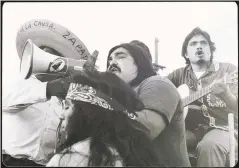  ?? COURTESY OF HERMAN BACA PAPERS, SPECIAL COLLECTION­S & ARCHIVES, UC SAN DIEGO ?? Ramon “Chunky” Sanchez with bullhorn during the Yes on Prop 14 rally, 1976.