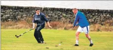  ??  ?? Duncan MacBrayne and Sandy Leiper during Kilmory pre-season training. 06_a09kilmory­shinty