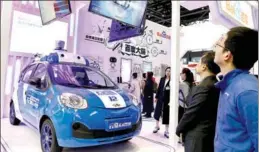  ?? ZHU XINGXIN / CHINA DAILY ?? A driverless car, developed by internet giant Baidu Inc, on display at the Light of the Internet Exposition in Wuzhen, Zhejiang province, on Tuesday. The expo, part of the Third World Internet Conference, opened on Tuesday.