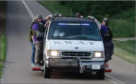  ?? Terrance Armstard / News-Times, file ?? SWAT: Members of the El Dorado Police Department Citizen's Police Academy conduct a SWAT exercise. The 2020 Citizens Police Academy will start April 14.