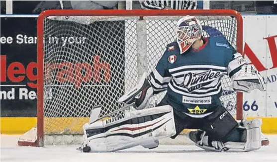  ?? Picture: Derek Black. ?? Stars goaltender Travis Fullerton makes a fine toe save against Braehead Clan.