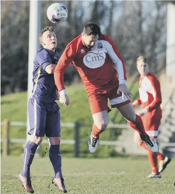  ??  ?? Washington (red) battle to a 0-0 draw against Guisboroug­h. Pictures by Tim Richardson