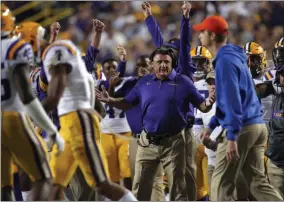  ?? GERALD HERBERT - THE ASSOCIATED PRESS ?? LSU head coach Ed Orgeron reacts on the bench on the sideline during the second half of the team’s NCAA college football game against Florida in Baton Rouge, La., Saturday, Oct. 12, 2019. LSU won 42-28.