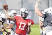  ?? CHARLES KING/STAFF PHOTOGRAPH­ER ?? After leading the Knights for two seasons, QB Justin Holman will lead UCF again in its season opener Sept. 3.