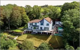  ??  ?? Luxury abounds both indoors and out at Makalu, with a sheltered deck leading out from the kitchen to a timberfram­ed treehouse, gazebo and two detached brick garages