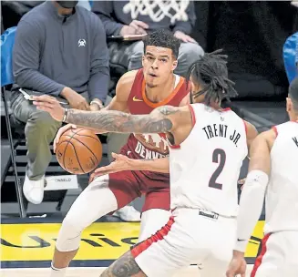  ?? AAron Ontiveroz, The Denver Post ?? Denver’s Michael Porter Jr. (1) was held out of games earlier this season due to the NBA’s health and safety protocol.