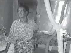  ??  ?? Mrs Alineth Mabhena stands inside her house whose roof is supported by logs