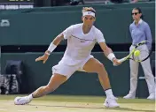  ?? ALASTAIR GRANT/THE ASSOCIATED PRESS ?? Rafael Nadal returns to Russia’s Karen Khachanov on Friday during their Men’s Singles Match on Day 5 at Wimbledon in London.