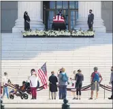  ?? ASSOCIATED PRESS FILE PHOTO ?? A photo for the history books, showing a crowd of admirers walk past the flag-draped casket of Supreme Court Justice Ruth Bader Ginsburg.