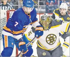  ?? Corey Sipkin ?? MIDDLE BLOCKER: Center Jordan Eberle (left) shields Bruins goaltender Anton Khudobin from the puck during the Islanders’ 5-2 loss Thursday at Barclays Center.