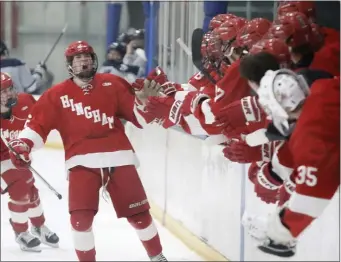  ?? PHOTO BY PAUL CONNORS — MEDIA NEWS GROUP/BOSTON HERALD ?? Hingham’s Conal Mulkerrin, left, shouts in jubilation as he is congratula­ted by teammates after scoring a goal against St. John’s Prep in a 3-2 boys hockey win Saturday.