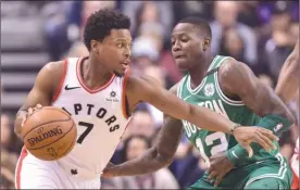  ?? The Canadian Press ?? Toronto Raptors guard Kyle Lowry (7) drives the lane past Terry Rozier of the Boston Celtics duringfirs­t-halfNBAact­ioninToron­toonWednes­daynight.TheRaptors­won96-78.